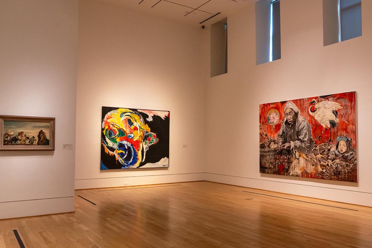 Installation view of one small and two large paintings